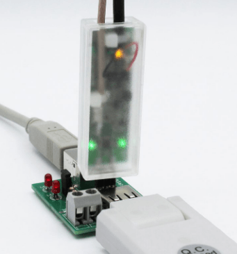 The USB adapter with a high-speed differential probe connected.