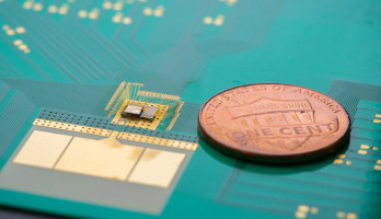 The wake-up chip is to the left of the penny. Image: David Baillot / UCSD.