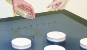 Tabula: trackable tangibles on multi-touch displays