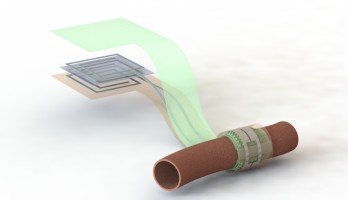 Artist impression van de bio-afbreekbare sensor die rond een bloedvat is gewikkeld. De verschillende lagen van de antenne zijn hier gescheiden getekend om de opbouw te verduidelijken (afbeelding: Levent Beker).