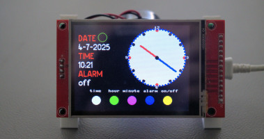 Digital and analog clock on a TFT touch display.