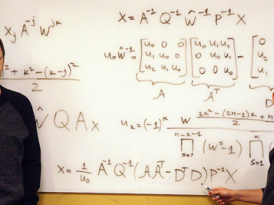 Vladimir Sukhoy (left) and Alexander Stoytchev (right) standing in front of the derived ICZT algorithm which uses structured matrix notation.