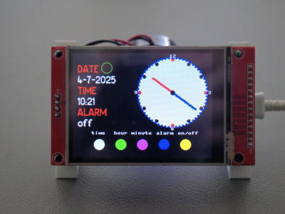 Digital and analog clock on a TFT touch display.