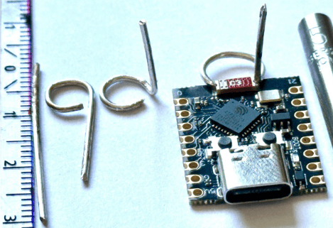 Part of the wire is bent into a horizontal loop, while the remaining section is angled vertically upwards.