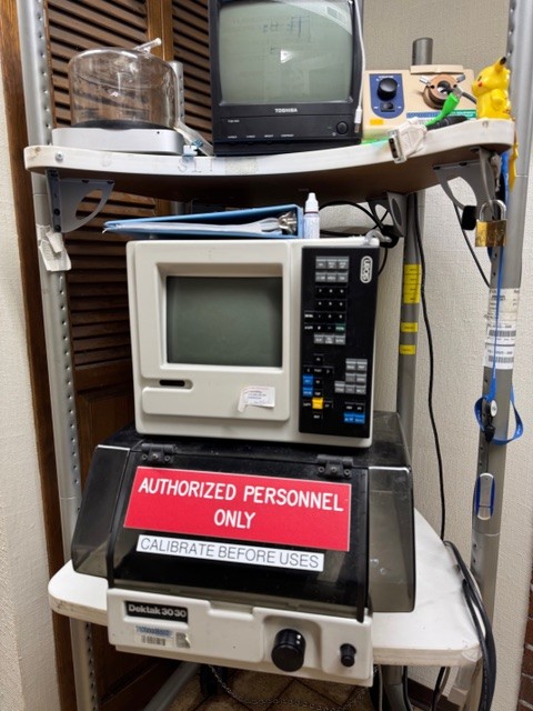 Jerry has in his workspace a Dektak 3030 Profilometer