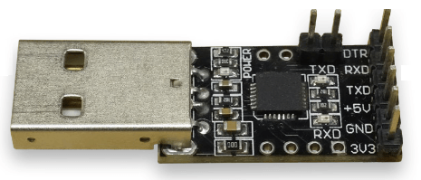 A CP2102-based module with the additional RTS and CTS pins (required)