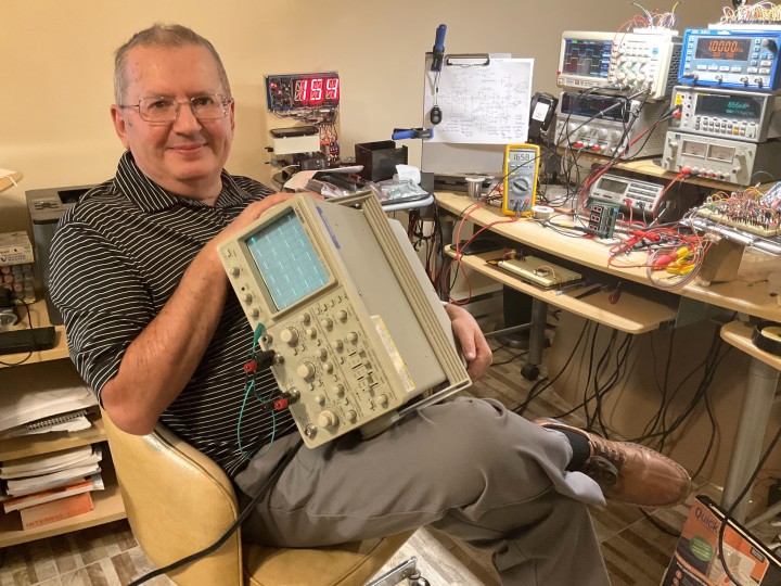 Chris Urban in his electronics workspace