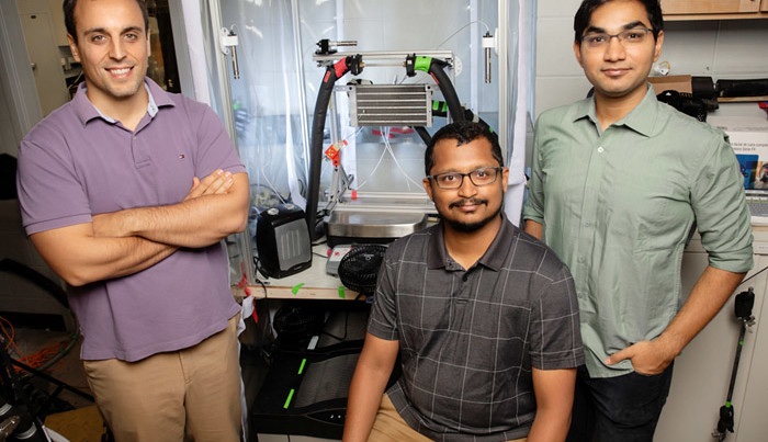 Prof. Nenad Miljkovic (left) and his team. Credit: L. Brian Stauffer.
 