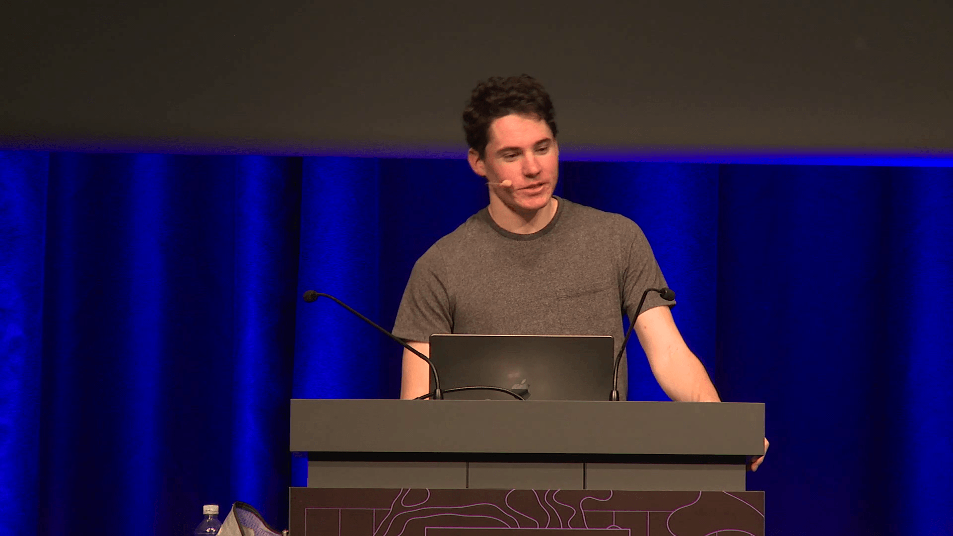 Aedan Cullen speaks at a lectern