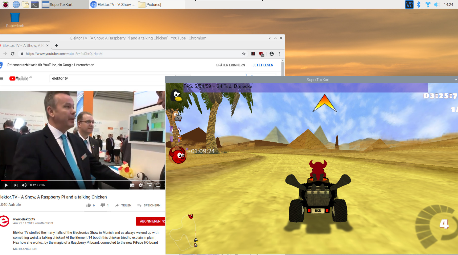Auf dem Desktop des RPi 4 laufen ein 3D-Spiel und ein Video im Browser.