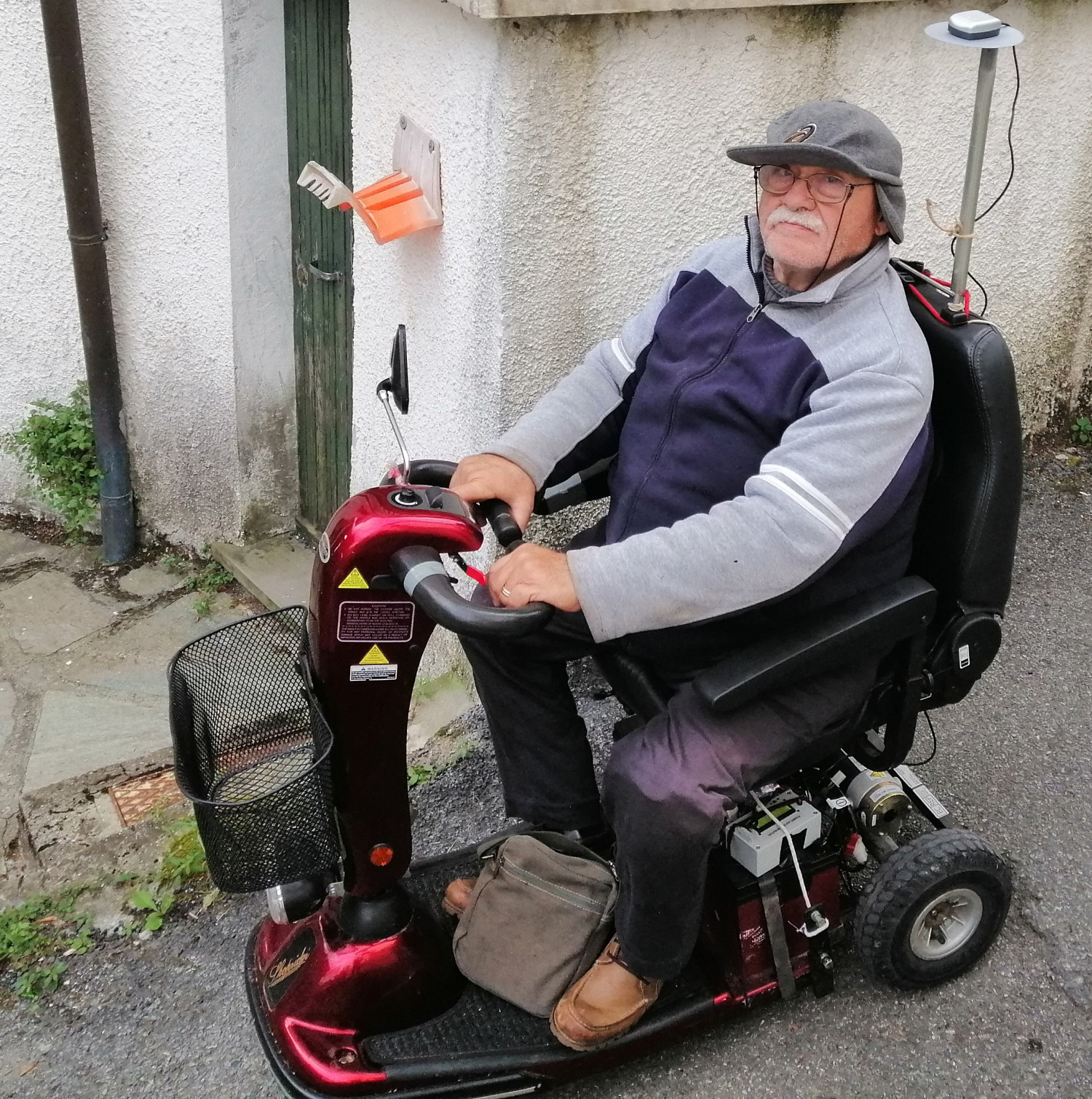 Figure 9: The electric scooter with the test equipment, and my friend Roberto visibly concerned about the modifications made to his vehicle!