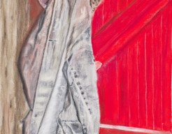 Een oude jas op een rode deur