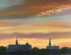 Siloette van de 3 Hoornse kerken bij ondergaande zon